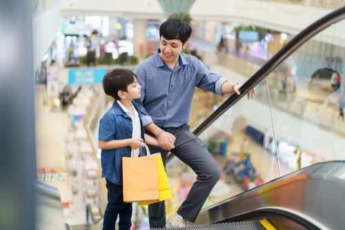 Happy,Cheerful,Man,And,Little,Son,Walking,In,The,Supermarket